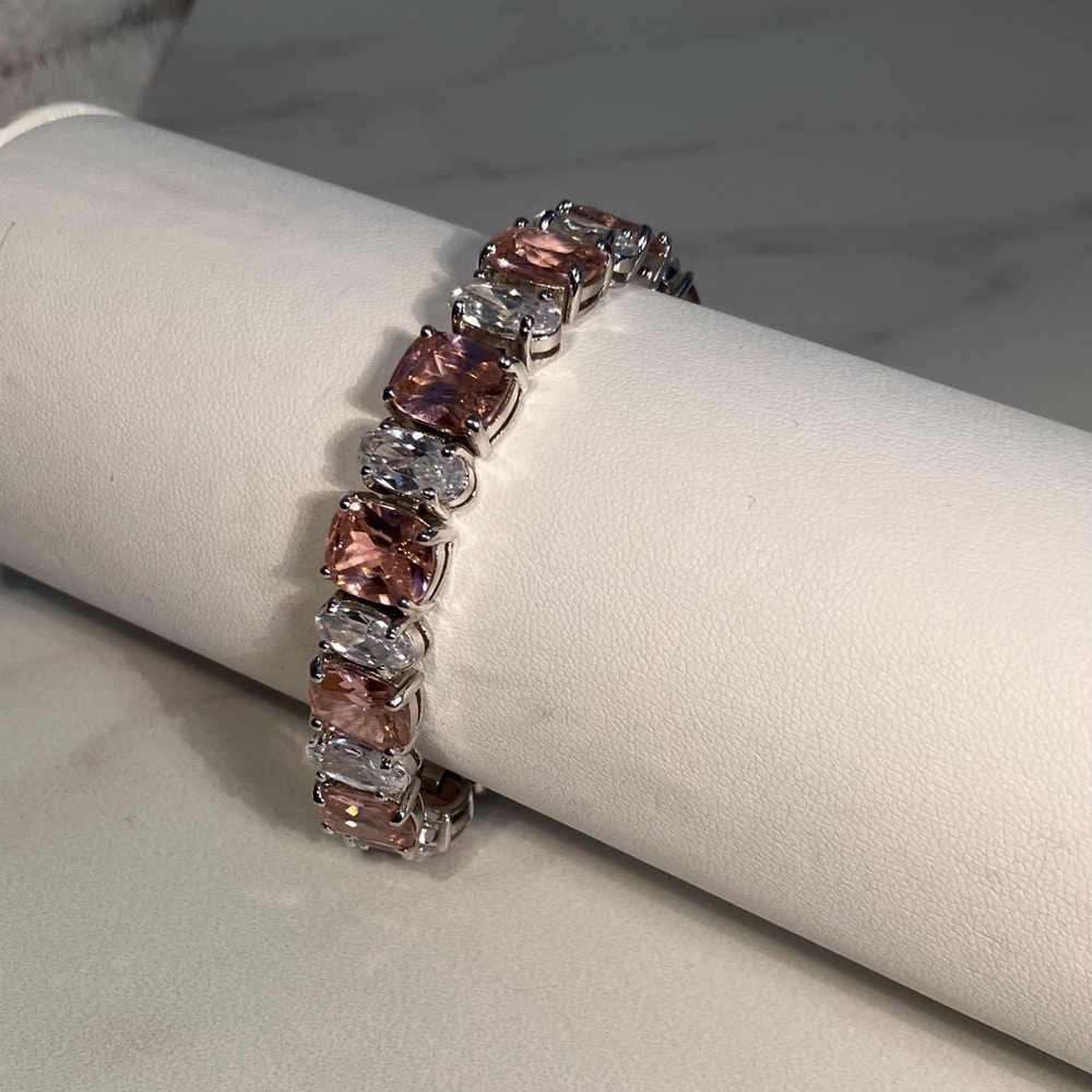 Elegant, pink and clear bracelet. Alternating cubic zirconia. 7 1/2 inches.